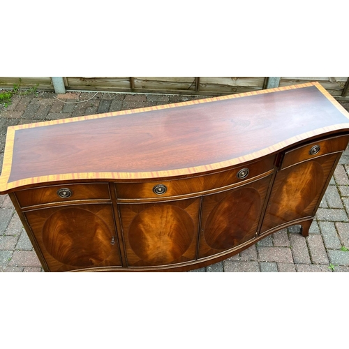 4144 - A good quality mahogany Serpentine fronted sideboard with banded top, centre drawer flanked by 2 sma... 