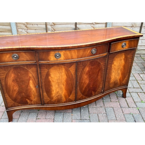 4144 - A good quality mahogany Serpentine fronted sideboard with banded top, centre drawer flanked by 2 sma... 