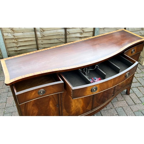 4144 - A good quality mahogany Serpentine fronted sideboard with banded top, centre drawer flanked by 2 sma... 