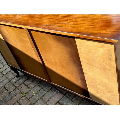 4146 - A mahogany breakfront low display cabinet, 2 glass panelled doors enclosing shelves, flanked by open... 