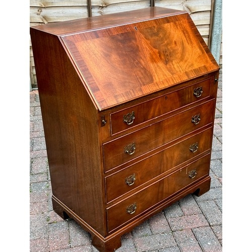 4140 - A reproduction mahogany bureau with fall front, 4 long drawers below on bracket feet, 77cm wide, 46c... 