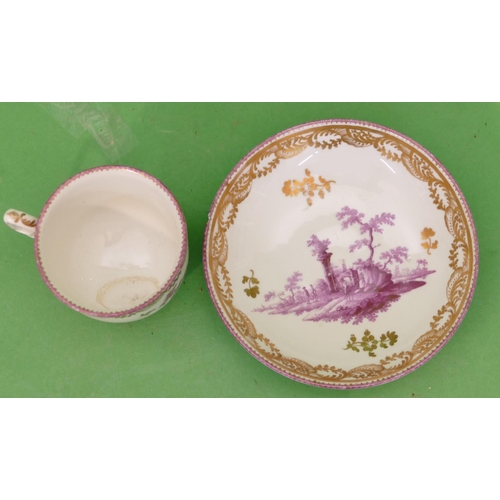 5010 - An 18th/19th Century Vienna Cup and Saucer on white ground having puce landscape building and gilt d... 