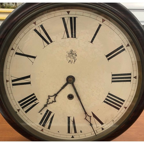5030 - A wall clock with Roman numerals, dial diameter 29cm.