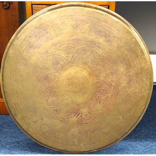 5032 - An Eastern brass round tray, 58cm diameter.