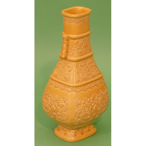 61 - An Oriental rectangular bulbous thin necked 2- handled vase on yellow ground with raised floral and ... 