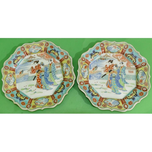 97 - A pair of Oriental scallop shaped plates with multi-coloured figure, butterfly, floral, leaf and scr... 