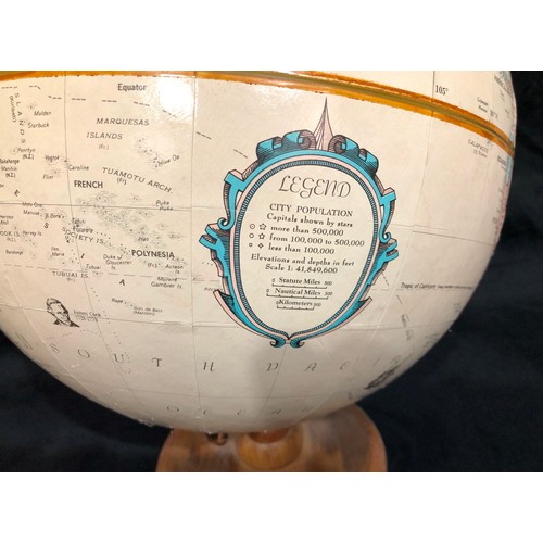 5037 - A globe on wood stand, globe 30.5cm diameter 39.5cm high overall.