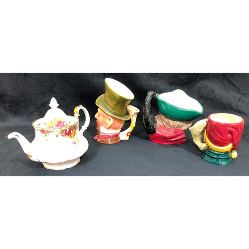 5038 - A Royal Albert Country Rose teapot and 3 character jugs (1 damaged)