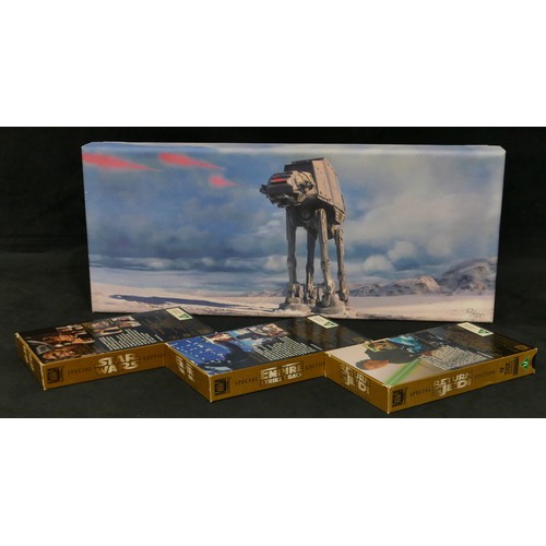 5041 - A Limited edition Star Wars print on canvas, 21 x 50cm and a boxed set of 3 Star Wars Trilogy Specia... 