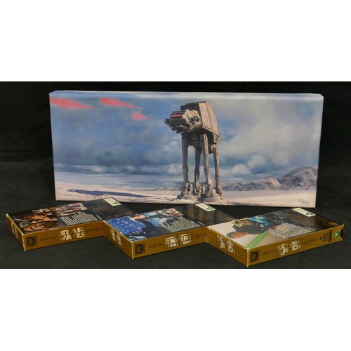 5041 - A Limited edition Star Wars print on canvas, 21 x 50cm and a boxed set of 3 Star Wars Trilogy Specia... 