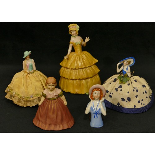 5045 - A china headed pin cushion in form of a lady, a china pot in form of a lady with removable top and 3... 
