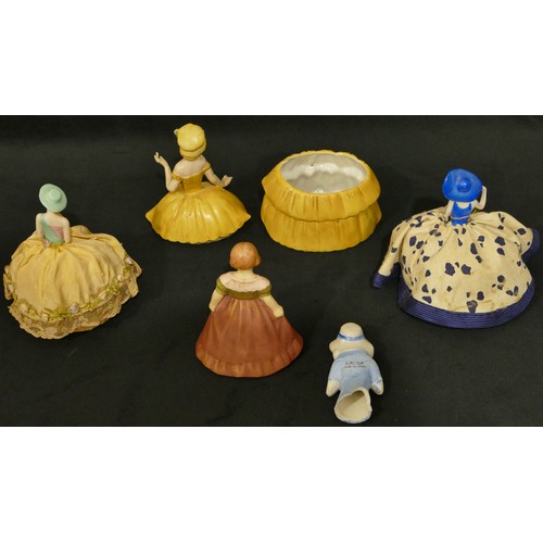 5045 - A china headed pin cushion in form of a lady, a china pot in form of a lady with removable top and 3... 