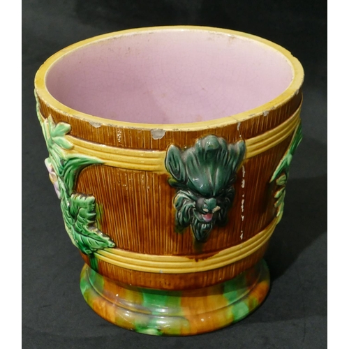 100 - A Majolica round 2-handled trumpet shaped jardiniere on brown, green and pink ground with raised mas... 