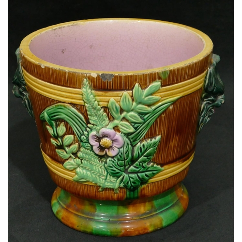 100 - A Majolica round 2-handled trumpet shaped jardiniere on brown, green and pink ground with raised mas... 