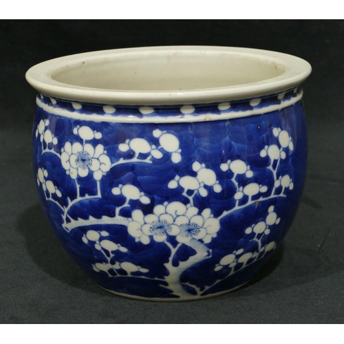 104 - A Chinese blue and white small round bulbous shaped jardiniere with branch and blossom decoration, 1... 