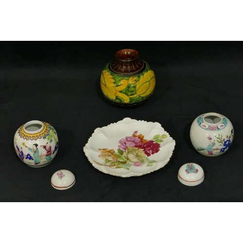 106 - A pair of Oriental small round bulbous lidded ginger jars on white ground with multi-coloured figure... 