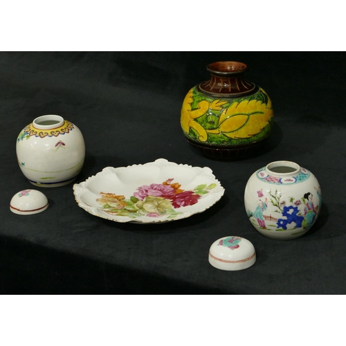 106 - A pair of Oriental small round bulbous lidded ginger jars on white ground with multi-coloured figure... 