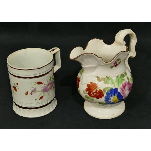 113 - A 19th Century Staffordshire tankard with hand painted floral and leaf decoration, 12.2cm high (2 ch... 