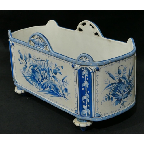 19 - A Continental china oblong jardiniere on white and blue ground with floral and leaf decoration, 35cm... 