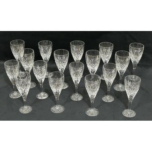 24 - A set of 9 Royal Doulton cut-glass wine glasses on round bases, 19cm high, a set of 8 matching small... 