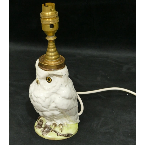 6 - A china and brass table lamp in form of an owl (ears restored), 27cm high overall.