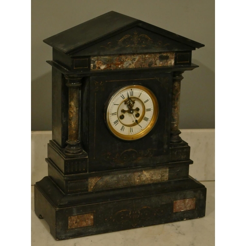 A large black slate 8-day striking visible movement mantle clock with ...