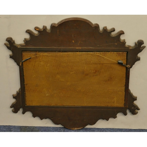 628 - A small burr walnut hanging wall mirror with scallop shaped rim and carved shell motif, 52cm wide, 4... 