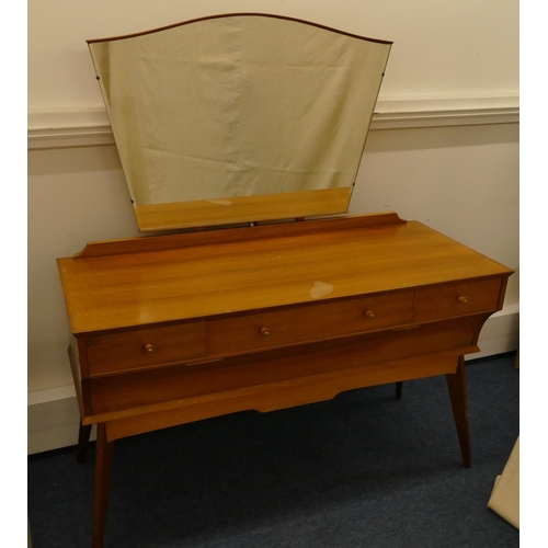 629 - A 1950's walnut dressing table with shaped swing mirror, 3 drawers with wood knob handles above 1 lo... 