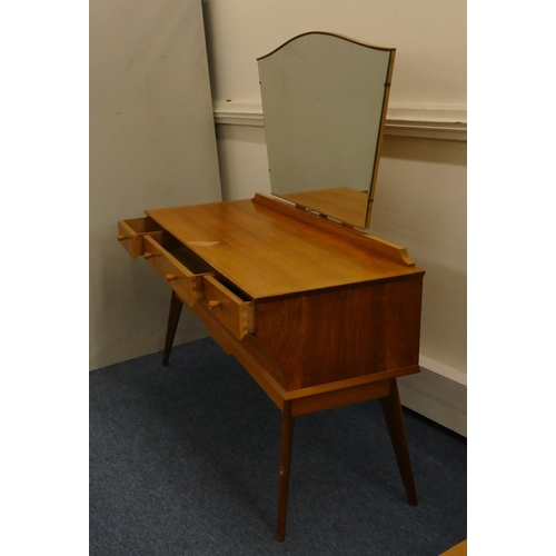 629 - A 1950's walnut dressing table with shaped swing mirror, 3 drawers with wood knob handles above 1 lo... 