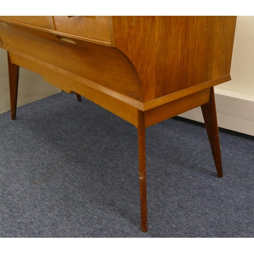 629 - A 1950's walnut dressing table with shaped swing mirror, 3 drawers with wood knob handles above 1 lo... 