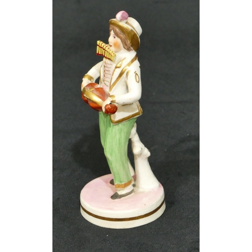 63 - A 19th Century Staffordshire figure of a standing gentleman playing mouth organ and violin on round ... 