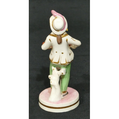 63 - A 19th Century Staffordshire figure of a standing gentleman playing mouth organ and violin on round ... 