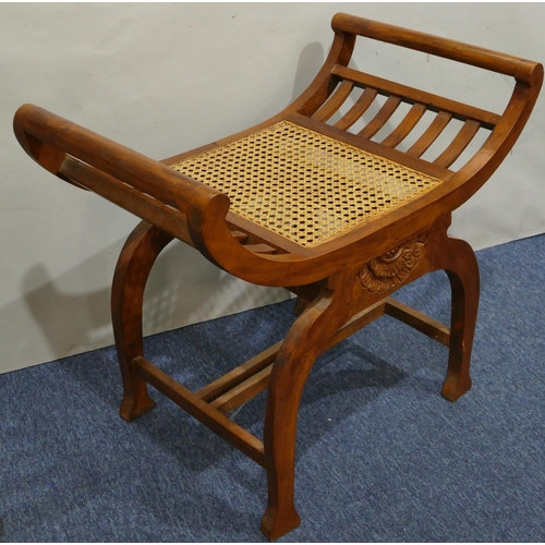 632 - A Continental hardwood stool with scroll ends Bergere seat, on splayed legs, 70cm wide, 62cm high.