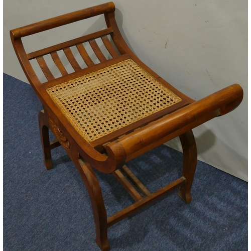 632 - A Continental hardwood stool with scroll ends Bergere seat, on splayed legs, 70cm wide, 62cm high.