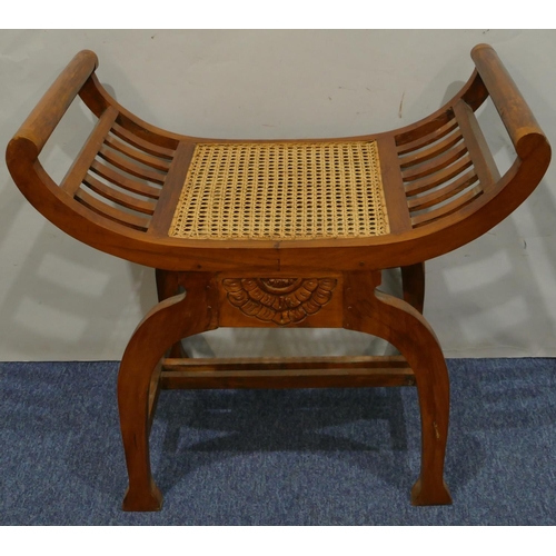 632 - A Continental hardwood stool with scroll ends Bergere seat, on splayed legs, 70cm wide, 62cm high.