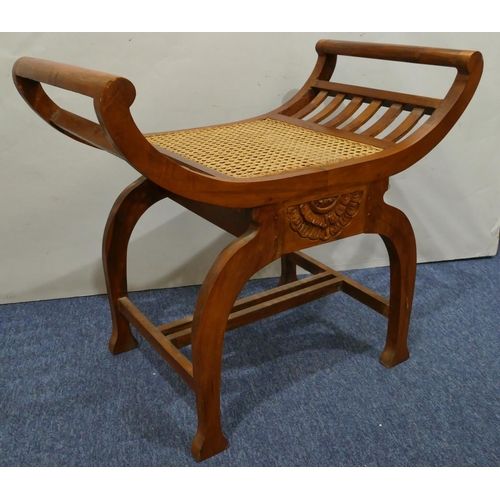 632 - A Continental hardwood stool with scroll ends Bergere seat, on splayed legs, 70cm wide, 62cm high.