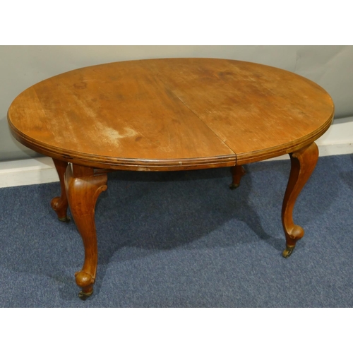 636 - An oval mahogany key wind table (no extra leaf or key), on cabriole legs with brass toes and castors... 