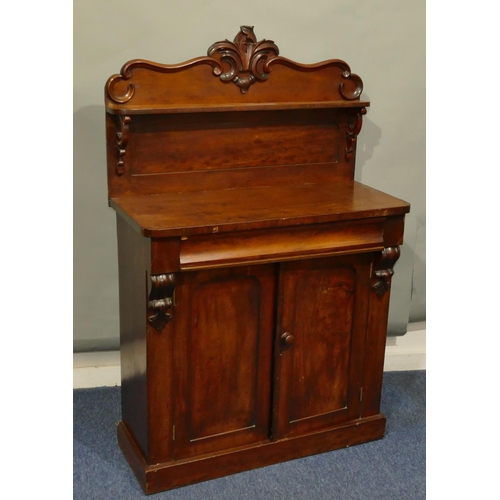 638 - A 19th Century mahogany chiffonier with shelf back, raised leaf and scroll decoration, single drawer... 