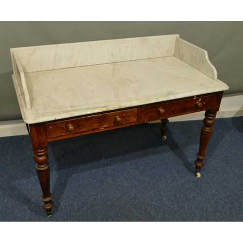 641 - A 19th Century pitch pine washstand with large white marble top and splashback, 2 drawers below, on ... 