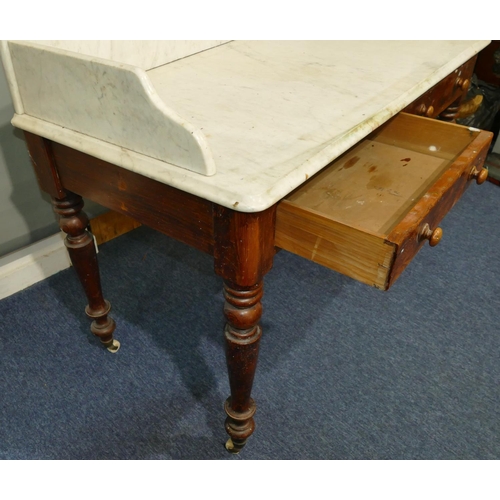 641 - A 19th Century pitch pine washstand with large white marble top and splashback, 2 drawers below, on ... 