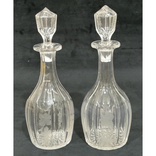 66 - A pair of cut glass round bulbous thin necked decanters with stoppers with engraved grape and vine d... 