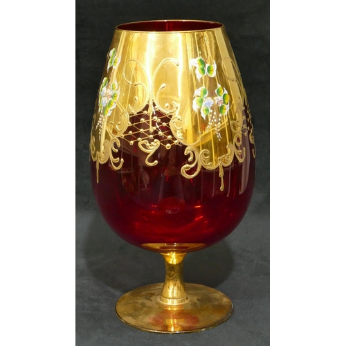 71 - A ruby tall bulbous shaped vase with all over gilt and floral decoration.