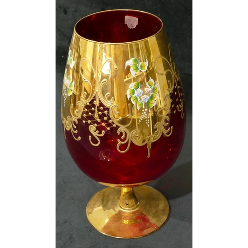 71 - A ruby tall bulbous shaped vase with all over gilt and floral decoration.