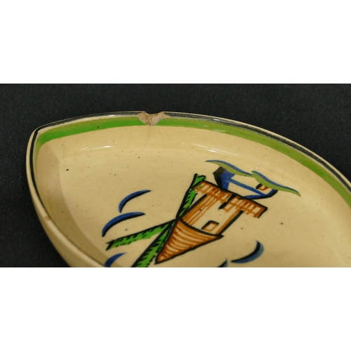 76 - 2 Ashtead Pottery small dishes with windmill and rabbit motif on cream and green ground, 13.5cm wide... 