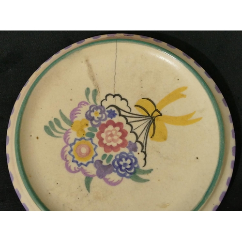 83 - A Poole round bulbous shaped bowl on vibrant ground with floral decoration, a Poole round plate, a P... 