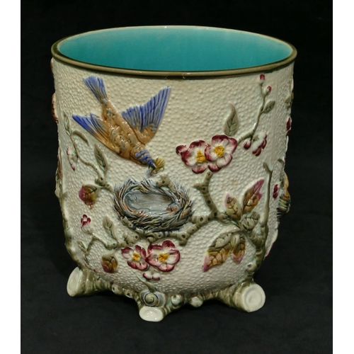 89 - A Wedgwood round bulbous jardiniere with raised multi-coloured bird, nest, branch, floral and leaf d... 