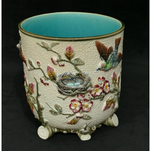 89 - A Wedgwood round bulbous jardiniere with raised multi-coloured bird, nest, branch, floral and leaf d... 