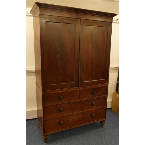 642 - A 19th Century mahogany linen press with 2 panel doors enclosing sliding trays, 2 short and 2 long d... 