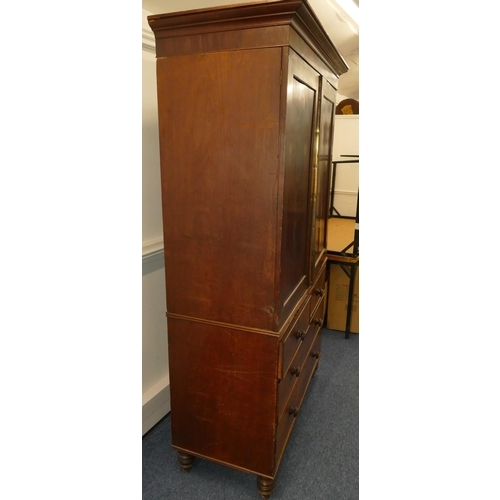 642 - A 19th Century mahogany linen press with 2 panel doors enclosing sliding trays, 2 short and 2 long d... 