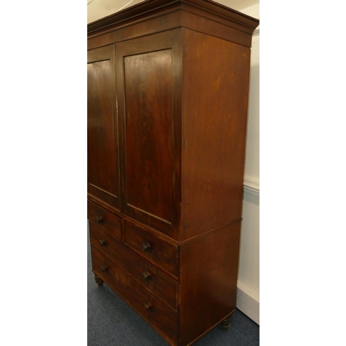 642 - A 19th Century mahogany linen press with 2 panel doors enclosing sliding trays, 2 short and 2 long d... 